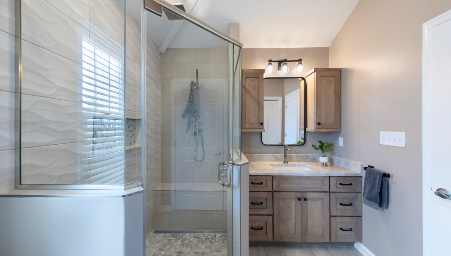 Nally Homes newly renovated bathroom oasis in Bethany Beach including a walk-in shower, and beautifully designed sink with drawers.