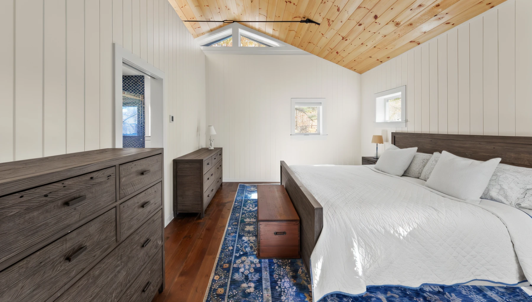 primary-bedroom-with-wood-paneled-ceiling
